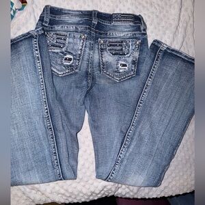 Woman’s Miss Me Mid-Rise Flare Jeans